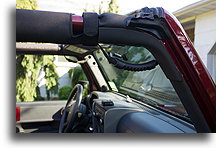 Both Front Grab Handles::A strap is looped around the roll bar::