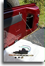 Mounting place in tailgate::Actuator before mounting in the tailgate::