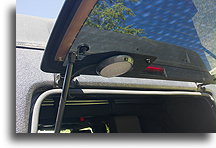 LED Lamp on the rear window::Steel bracket is used to attach heat exchanger to the dual battery tray::