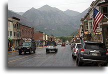 Main Street in Telluride::The weather was awful; in the background nearly vertical cliff that we have just conquered::